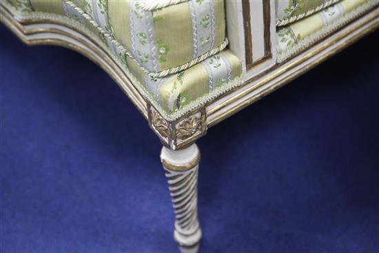 A suite of George III white and gilt seat furniture, comprising five armchairs and a settee, W.6ft 6in.